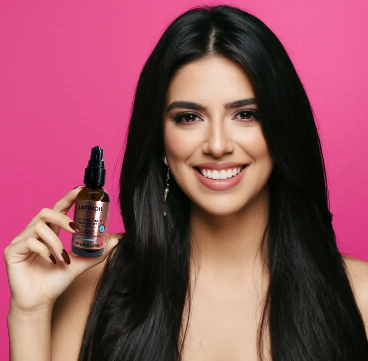 Smiling Latina woman with long, shiny black hair holding Latinoil Chia Oil Hair Treatment against a pink background.